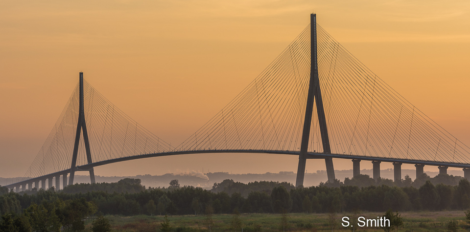 The Pont de Normandie is a cable-stayed bridge that spans the river Seine linking Le Havre to Honfleur in Normandy, northern France.